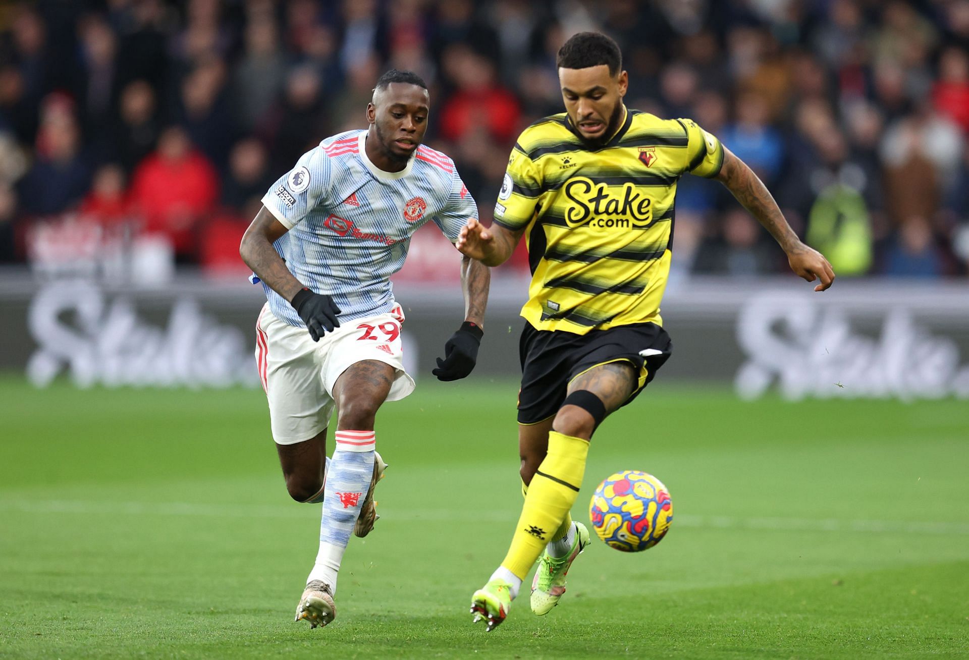 Manchester United's Aaron Wan-Bissaka (left) in action against Watford City